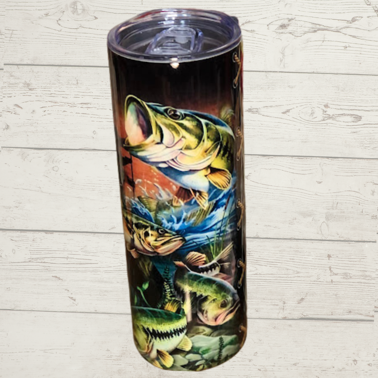 Bass/Fishing/Camoflauge 20 oz skinny sublimation tumbler  vivid Detail image of several bass with one breaking through water with fisherman and boat floating on water in background