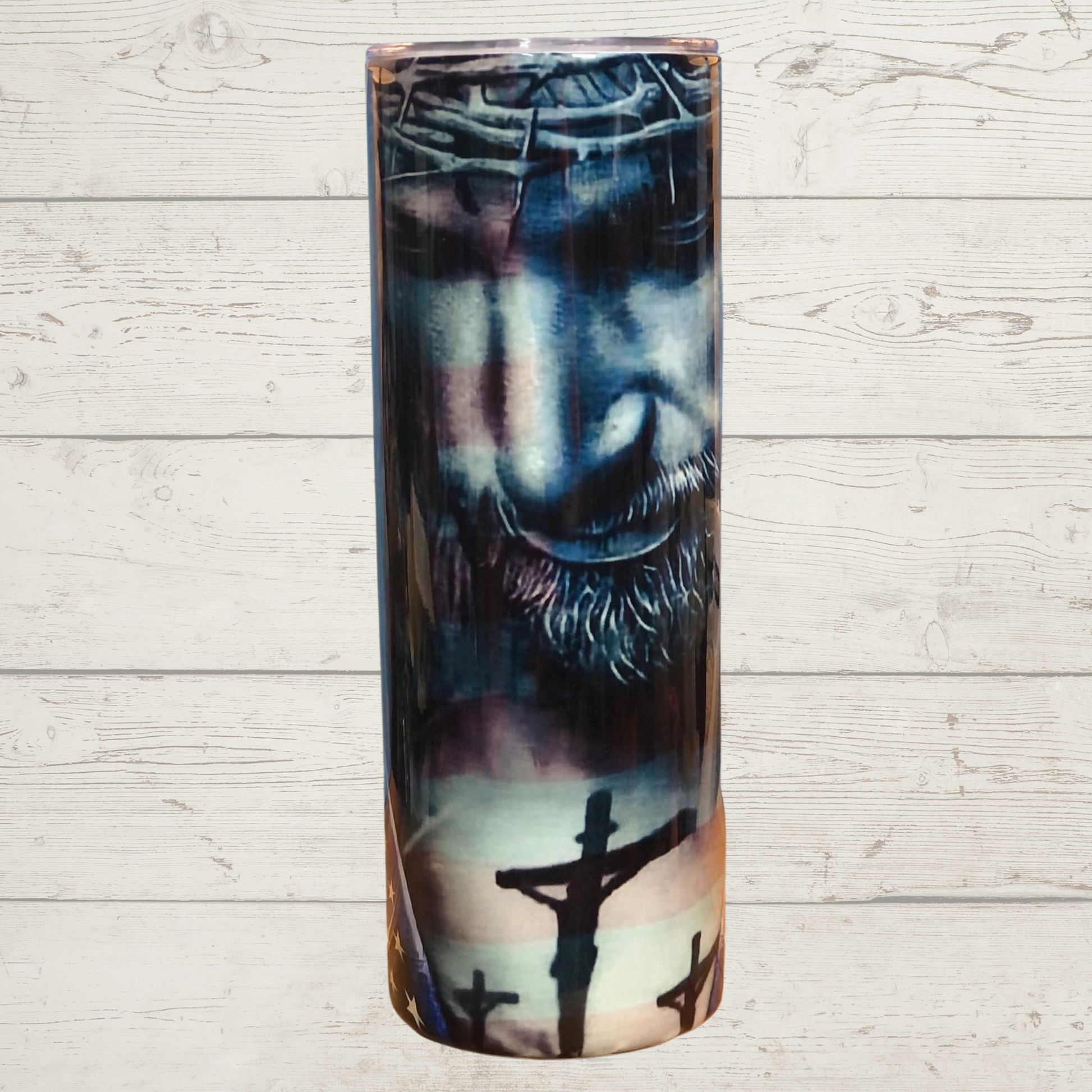 Jesus and American Flag 20 oz Skinny Stainless Steel Sulimation Tumbler Black and White Jesus with a Crown of Thorns Looking down Upon the Crucifixion while Embracing the American Flag Red White and Blue Vivid High Definition Image on a Quality 20 oz Tumbler/Mug/Cup with Lid and Stainless Reusable Straw