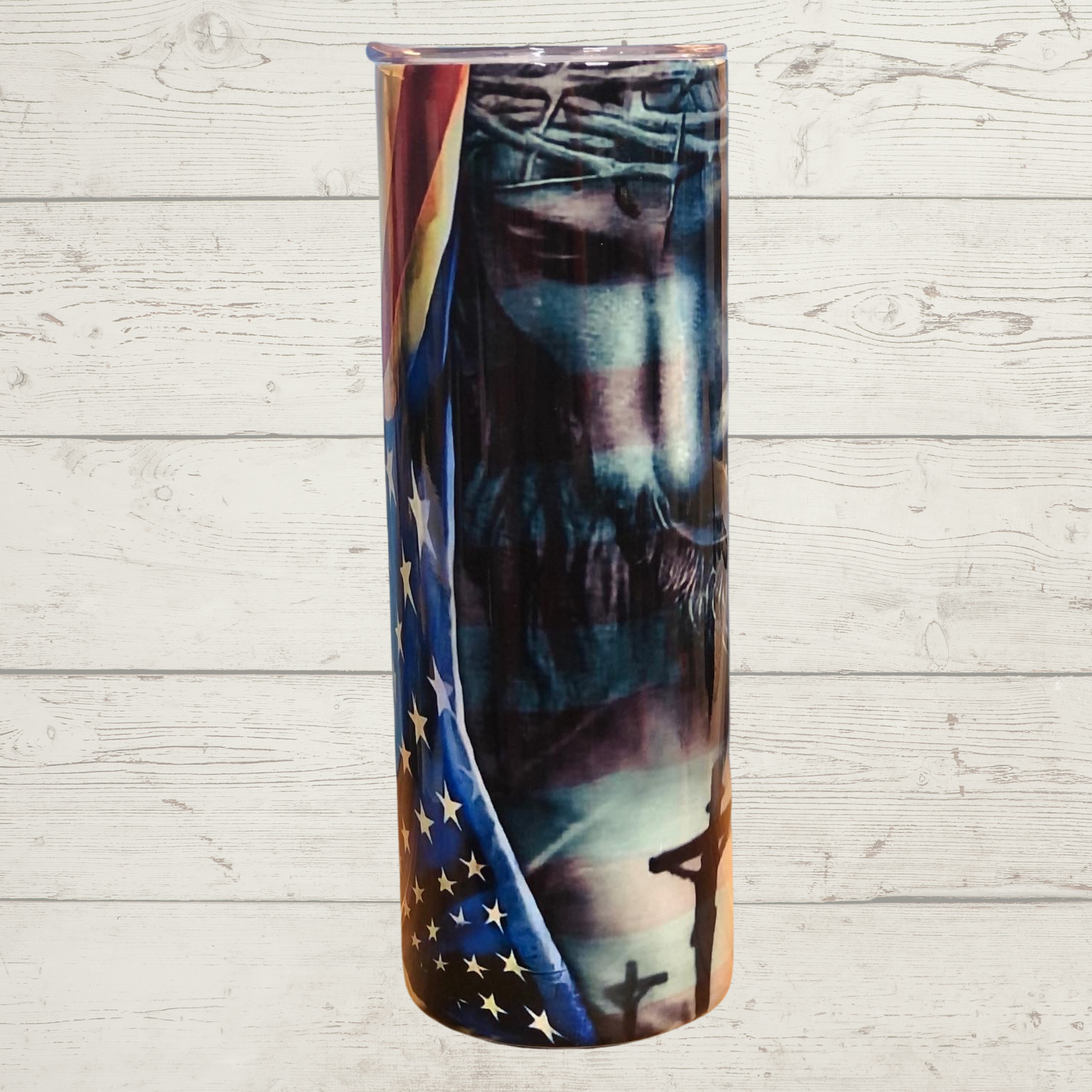 Jesus and American Flag 20 oz Skinny Stainless Steel Sulimation Tumbler Black and White Jesus with a Crown of Thorns Looking down Upon the Crucifixion while Embracing the American Flag Red White and Blue Vivid High Definition Image on a Quality 20 oz Tumbler/Mug/Cup with Lid and Stainless Reusable Straw